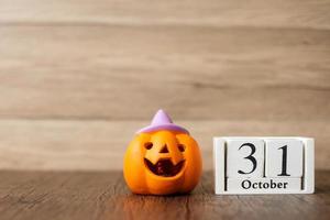 Happy Halloween day with Jack O lantern pumpkin and 31 October calendar. Trick or Threat, Hello October, fall autumn, Festive, party and holiday concept photo