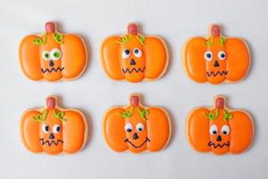 Happy Halloween day with funny Cookies, different Pumpkin biscuits on table background. Trick or Threat, Hello October, fall autumn, Traditional, party and holiday concept photo