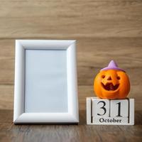 Orange pumpkin, 31 October calendar and frame with copy space for text. Happy Halloween day, Hello October, fall autumn season, Festive, party and holiday concept photo