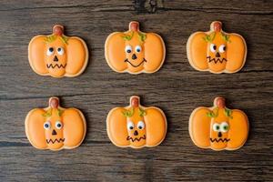 Happy Halloween day with funny Cookies set on wooden table background. Trick or Threat, Hello October, fall autumn, Festive, party and holiday concept photo