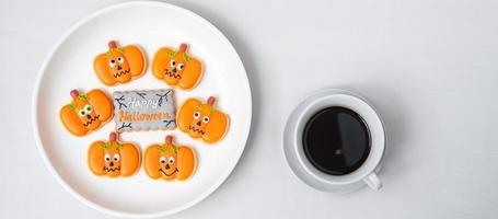 hot coffee cup with funny Halloween Cookies. Happy Halloween day, Trick or Threat, Hello October, fall autumn, Traditional, party and holiday concept photo