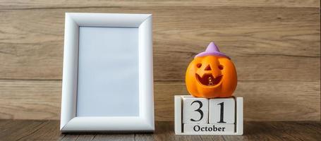 Orange pumpkin, 31 October calendar and frame with copy space for text. Happy Halloween day, Hello October, fall autumn season, Festive, party and holiday concept photo