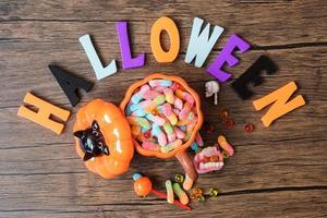 Happy Halloween day with ghost candies, pumpkin,  bowl and decorative. Trick or Threat, Hello October, fall autumn, Festive, party and holiday concept photo