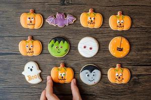 Happy Halloween day with funny Cookies set on wooden table background. Trick or Threat, Hello October, fall autumn, Festive, party and holiday concept photo