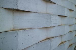 wall of white bricks arranged in a zig zag photo