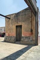 abandoned building beams, wooden door, wooden door, concrete apartente, beams protruding, mexico photo