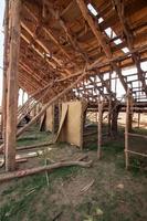 man making wooden roof, mason making roof formwork, with cap and hammer, mexico photo