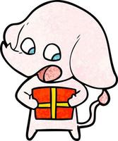 elefante de dibujos animados lindo con regalo de navidad vector