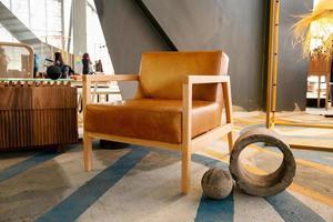 armchair, chair, individual sofa, solid natural wood structure, seat and back in natural leather photo