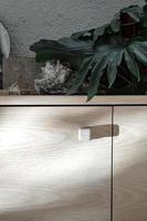 wooden furniture light and shadow, light wood credenza contrasting with light and shadow, vegetation photo