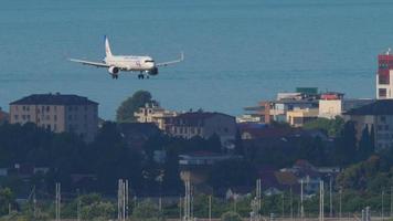 SOCHI, RUSSIA JULY 29, 2022 - Airplane of Ural Airlines approaching before landing at Sochi airport. Tourism and travel concept video