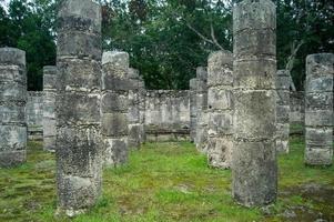 mayan pyramids in mexico, stone construction, surrounded by vegetation, deep jungle photo