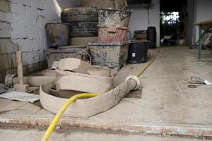 Water damage - water being pumped out of a flooded basement in Cologne, Germany, after heavy rain falls. photo