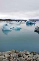 Jokulsarlon Glacier Lagoon in Iceland with icebergs and clear water photo