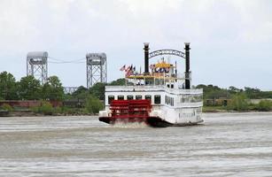 New Orleans, Louisiana, USA, 2019 - Steamboat working its way up Mississippi river photo
