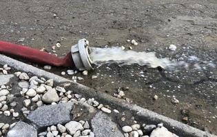 Extreme weather - water being pumped out of a flooded basement in Cologne, Germany, after heavy rain falls. photo