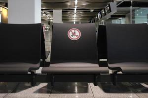 Social distancing signs at airport gate photo