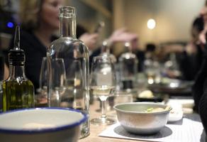 Group of blurred out people enjoying dinner in a restaurant photo