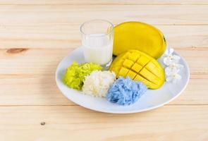 Mango and natural colored sticky rice with coconut milk, Thai dessert photo