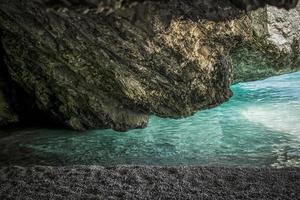 Cliffs and water in the cave at Myrtos Beach at the island of Kefalonia photo