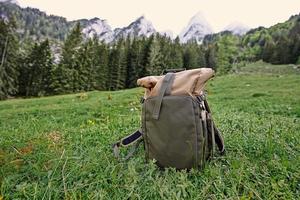 Backpack in mountains at Vorderer Gosausee, Gosau, Upper Austria. photo