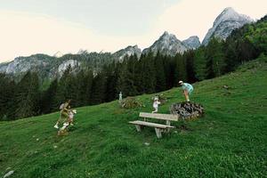 Mother with kids at Vorderer Gosausee mountains, Gosau, Upper Austria. photo