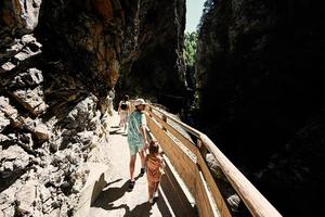 Brother with sister hikking in Liechtensteinklamm or Liechtenstein Gorge, Austria. photo