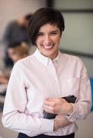 hispanic businesswoman with tablet at meeting room photo