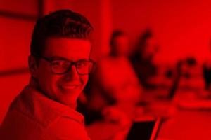 Businessman using tablet in modern office photo