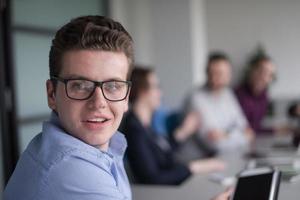 Businessman using tablet in modern office photo