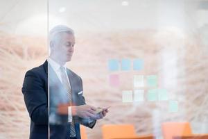 senior business man making plans with sticker photo
