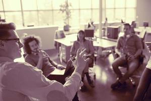 Young Business Team At A Meeting at modern office building photo