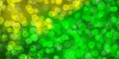 Light Green, Yellow vector backdrop with dots.