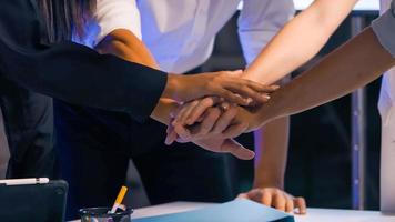 Business Team stack of hands for startup project. Close up of businesspeople putting their hands together. photo