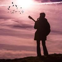 Girl with guitar outdoors photo