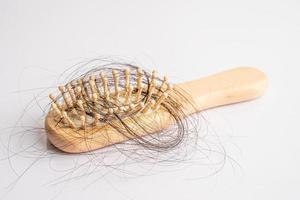 Hair loss fall with comb bush serious problem health, beauty and cosmetic concept. photo