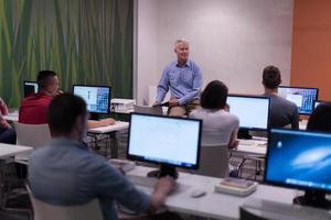 teacher and students in computer lab classroom photo