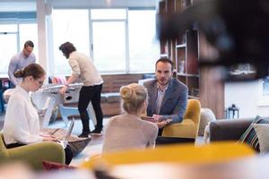 Startup Business Team At A Meeting at modern office building photo