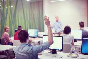 student answering a question in classroom photo