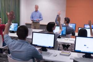 teacher and students in computer lab classroom photo