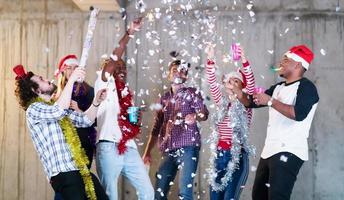 multiethnic group of casual business people having confetti party photo