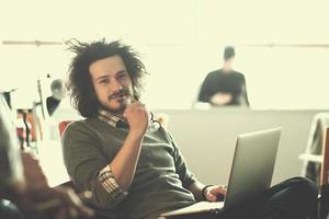 businessman working using a laptop in startup office photo