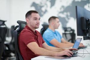 two male software developers working on computer photo