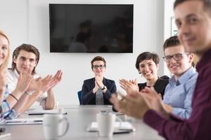 Group of young people meeting in startup office photo