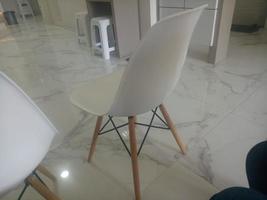 modern white chair on marble floor photo