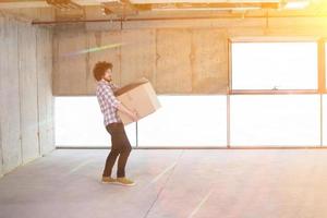 business man carrying cardboard box photo