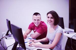 technology students group working  in computer lab school  classroom photo