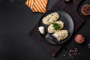 Traditional Lithuanian dish zeppelin, boiled potato dumplings stuffed with minced meat photo
