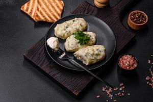 Traditional Lithuanian dish zeppelin, boiled potato dumplings stuffed with minced meat photo