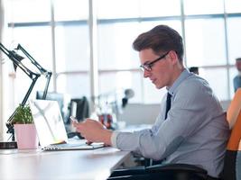 businessman working using a laptop in startup office photo